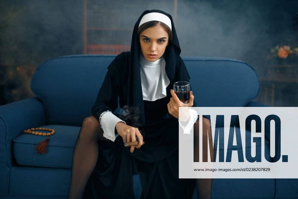 Sexy Nun In A Cassock With Cigare And Glass Of Wine Sitting Spreading Her Legs Front View Vicious