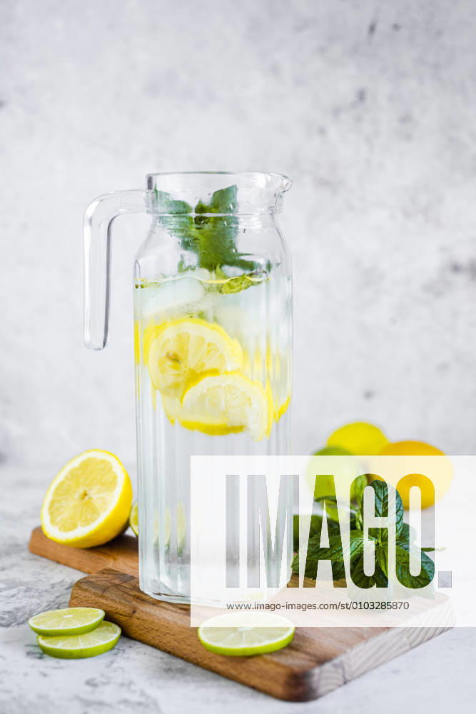Detox water with lemon, lime and mint and ice cubes GIOF08702