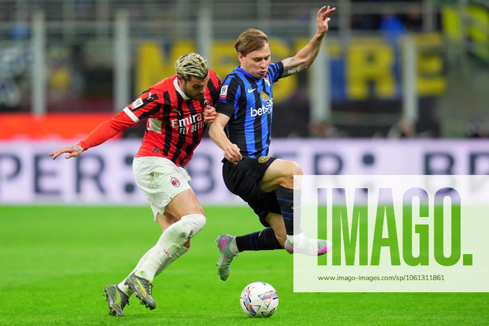 Inter MilanÕs Nicolo Barella fights for the ball with AC MilanÕs Theo Hernandez during the Italy Cup Frecciarossa soccer match between Inter and Milan at San Siro Stadium in Milan , North Italy - Wednesday April 23 , 2025 . - Soccer .