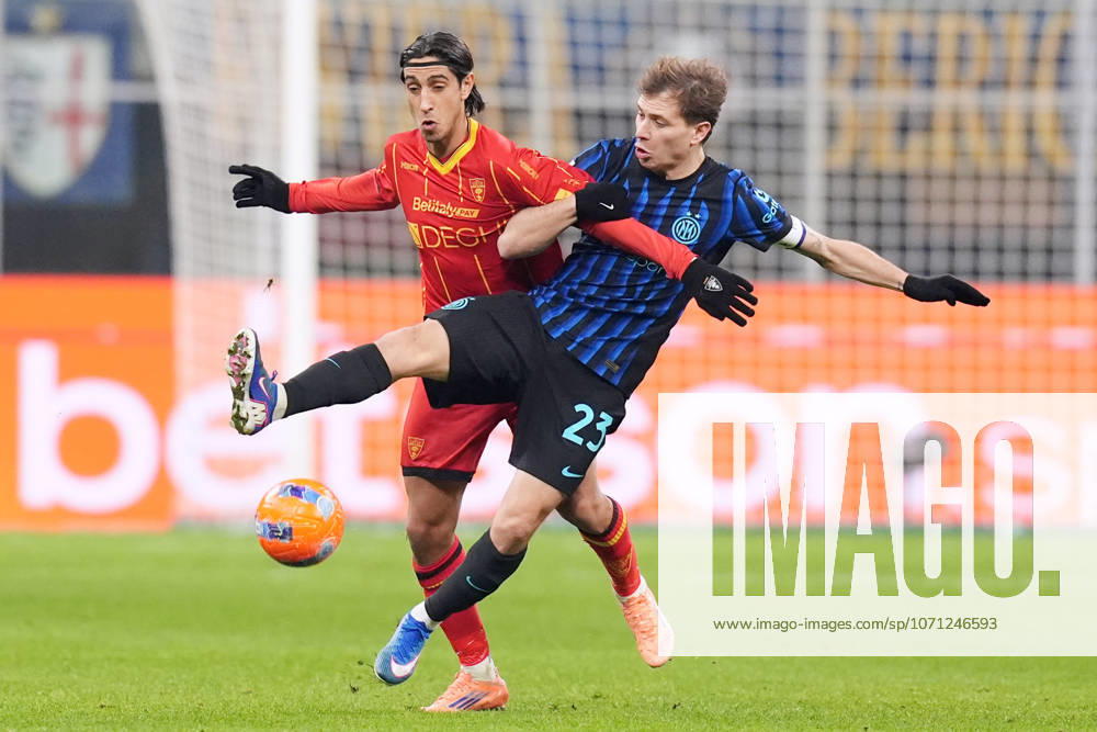Inter Milans Nicolo Barella fights for the ball with Lecces Youssef Maleh during the Serie A soccer match between Inter and Lecce at the San Siro Stadium in Milan , north Italy - Sunday , January 14 , 2026. - Soccer .