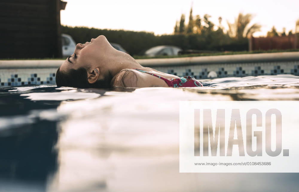 Beautiful woman in pool, Model released, Property released