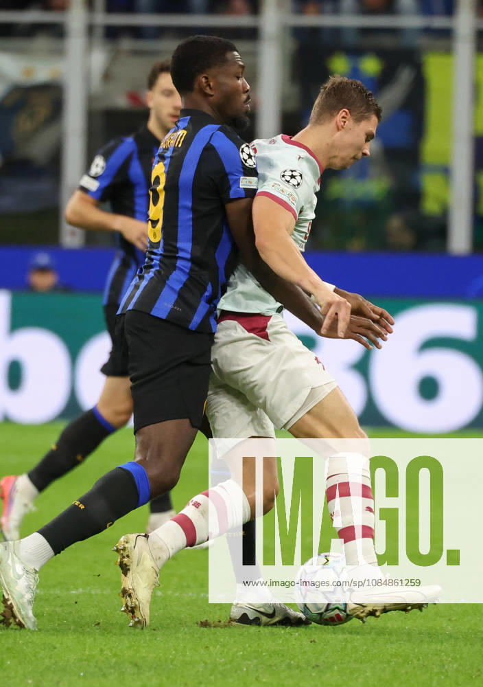 FC Shakhtar Donetsk s defender Valerii Bondar in action against FC Inter Milan s forward Marcus Thuram during the UEFA Champions League soccer match between FC Inter Milan and FC Shakhtar Donetsk at Giuseppe Meazza stadium in Milan, 21 October 2026. ANSA MATTEO BAZZI. UEFA Champions League; FC Inter Milan Vs FC Shakhtar Donetsk - ZUMAa110 20261021_zaf_a110_065