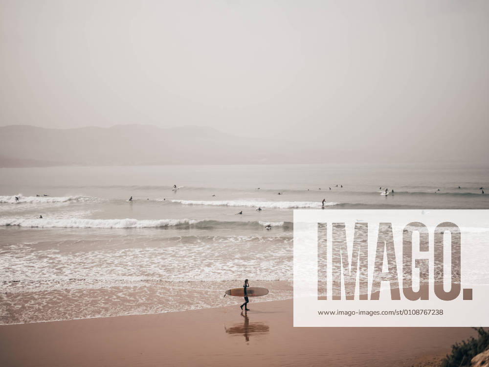 People surfing in ocean, Model released