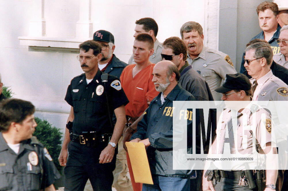Alleged Oklahoma city bomber TIMOTHY MCVEIGH, 27, is led by law enforcement out of the Noble County Courthouse in Perry, Oklahoma on April 21, 1995 following his arrest in the bombing of the Murrah Federal Building two days earlier. McVeigh was put to death on June 11, 2001 after being convicted of the crime. Oklahoma City United States - ZUMAd150 20010417_znp_d150_008