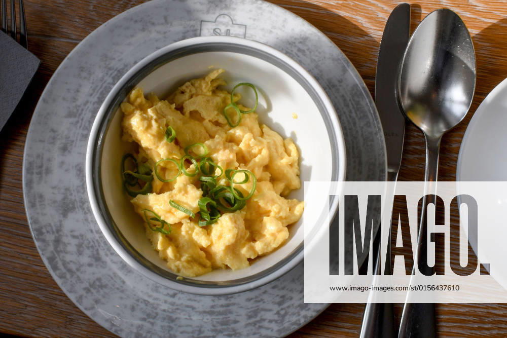 The portion of scrambled eggs, arranged in a bowl, stands on a breakfast table in a hotel in Schleswig Photo Winfried Rothermel