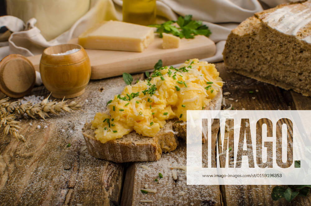 Scrambled eggs on homemade bread, beautiful rustic bread baked home in oven from homemade leaven , 22992300.jpg, scrambled, eggs, egg, breakfast, food, fried, meal, toast, bread, plate, white, pan, lunch, morning, closeup, yellow, fresh, table, dish, delicious, background, tasty, snack, green, leaven, gourmet, cuisine, herb, appetizer, omelet, dinner, bacon, salmon, healthy, iron, cooked, sausage, traditional, wooden, parsley, rustic, old school, wood, bio, organic, microgreens, herbs, chive, bread, slice,