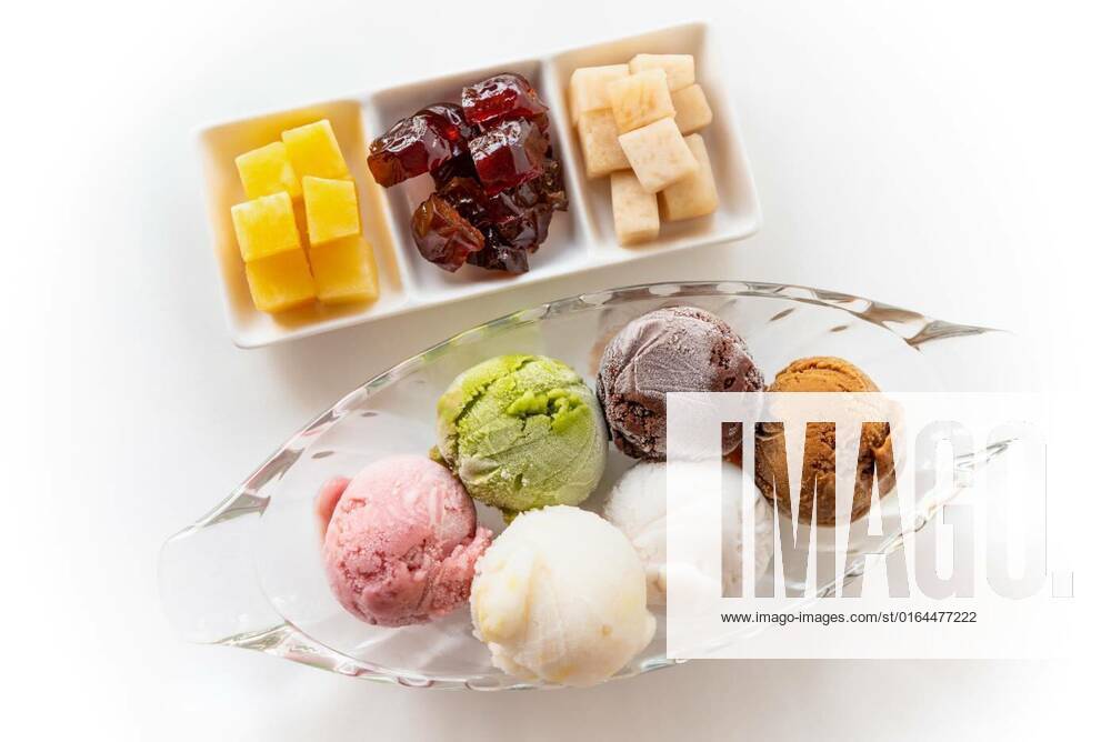 Top view colorful ice cream, Top view multi-colored ice cream in a clear dish and sweet processed fruit for eating together in vintage Thai style, Set of colorful ice cream scoops of different colors on the white table background, 28.04.2020 23:12:26,