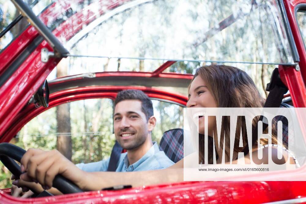 Vacations finally! Let s go!, Young couple on roadtrip through countryside, Young couple on roadtrip through countryside model released, Symbolfoto , 22.01.2021,