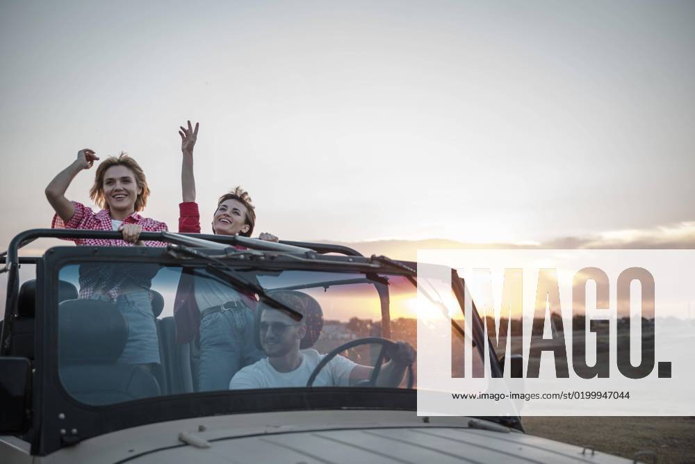 Three friends traveling by car having fun three friends traveling by car having fun