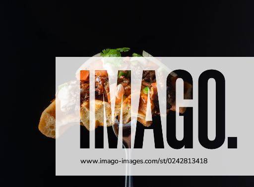A closeup shot of a waffle on a fork with salmon and onions *** einer closeupe erschossen des einer Waffel am einer Gabel mit Lachs und Zwiebeln 10543997