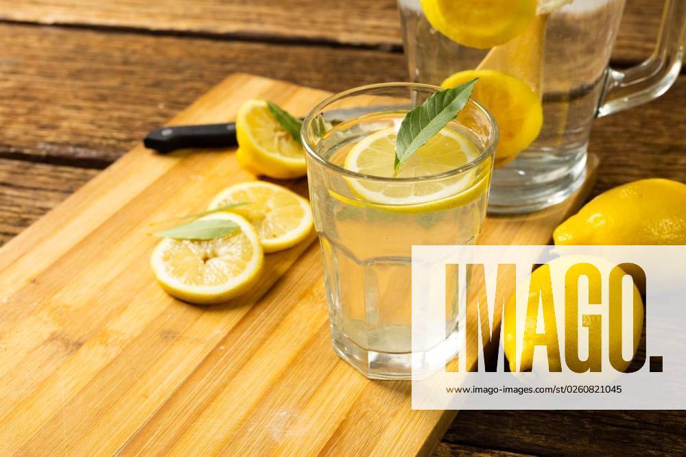 Close-up of lemonade in jug and drinking glass with lemons and leaves on cutting board over table Close-up of lemonade in jug and drinking glass with lemons and leaves on cutting board over table. Unaltered, wood, drink, yellow, citrus fruit, food, healthy concept., model released, , property released, Cape Town, South Africa, 09.05.2022, 3679653.jpg, close,lemonade,jug,drinking glass,lemon,leaf,cutting board,table,unaltered,wood,yellow,citrus fruit,food,healthy,concept,fresh,organic,wooden,closeup,natural,green,fruit,plant,diet,delicious,background,drink,white,health,sweet,tasty,ingredient,nutrition,meal,freshness,drinking,glass,cutting,board,citrus