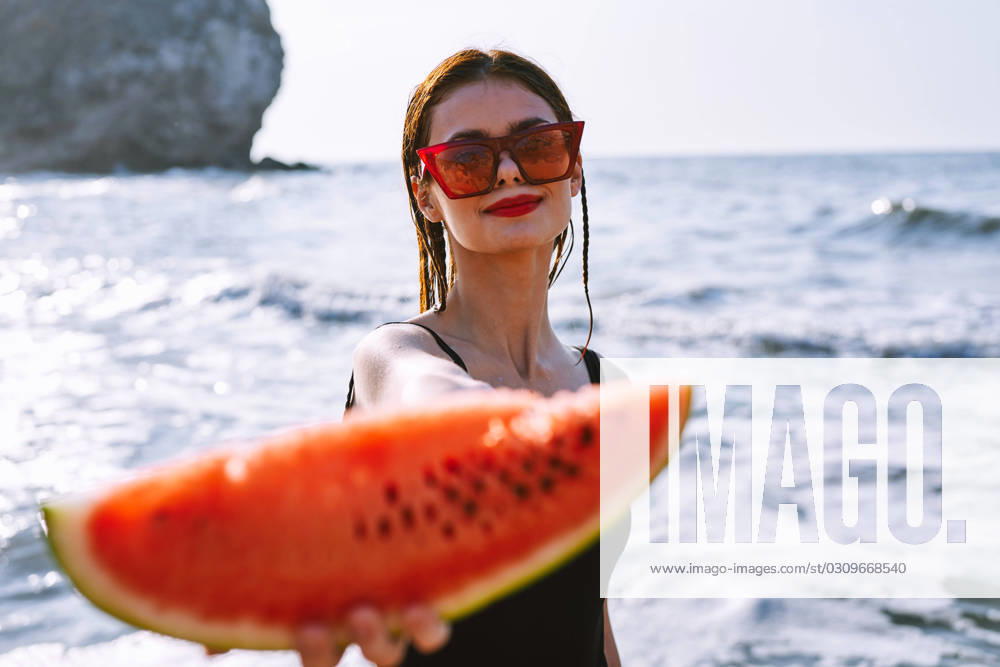 Cheerful pretty woman in black swimsuit watermelon fashion travel. High quality photo, model released, , 42044530.jpg, beach, watermelon, summer, woman, girl, fruit, food, model, diet, beauty, vacation, travel, healthy, water, smile, blue, fashion, lady, sexy, red, sea, background, person, hat, sunglasses, summertime, hot, slice, portrait, concept, glamour, hand, lips, color, round, seeds, cat, up, bracelet, lipstick, hold, manicure, heat, nature, nutrition, melon, wood, quench, hungry, laugh RECORD DATE NOT STATED