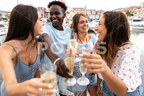 Group of multiracial friends having fun celebrating birthday on holidays - Millennial generation people cheering with champagne on boat party - Summer lifestyle concept friends, celebrate, birthday, people, vacation, drink, champagne, group, multiracial, young, holidays, celebration, fun, happy, smile, laughing, boat, party, together, cheerful, alcohol, toasting, cheering, millennial, teenager, man, woman, african american, friendship, happiness, lifestyle, adult, eve, enjoyment, diverse, multiethnic, enjoy, four, group of people, tourist, drinking, caribbean, australia, american, sailing, yacht, clinking, travel