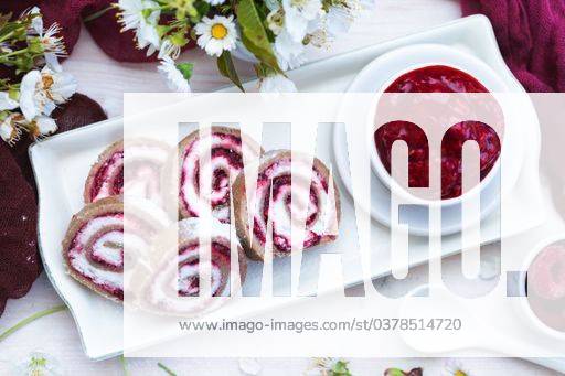 An amazing view of tasty looking raspberry rolls and raspberry jam put on a white plate 332319 RECORD DATE NOT STATED