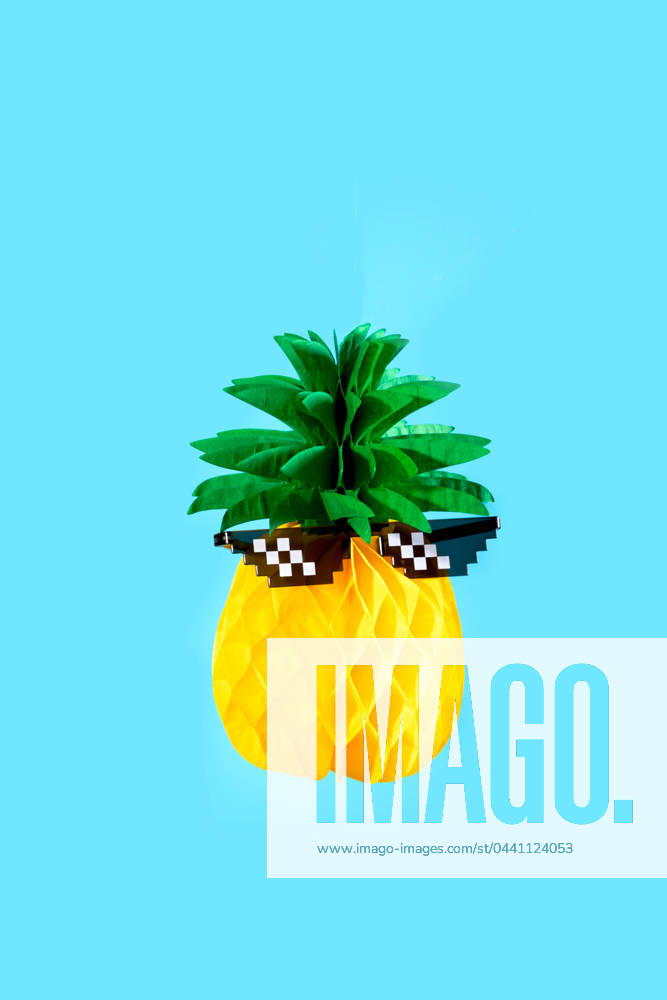 A quirky pineapple donning pixelated sunglasses set against a vibrant blue background. Model Released SergioVictorVega_ID19908_590163_001