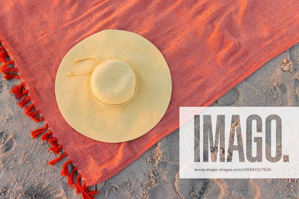 A straw hat rests on a vibrant beach towel, with copy space A straw hat rests on a vibrant beach towel, with copy space. Footprints surround the scene, suggesting a leisurely day at the beach., model released, , property released, Cape Town, South Africa, 2024-01-23T22:00:00.000Z, 5113266.jpg, straw hat,beach towel,copy space,footprints,leisurely,beach,vibrant,scene,relax,vacation,sand,sunny,sea,ocean,summer,sunshine,relaxation,hat,travel,holiday,tropical,coast,shore,outdoor,accessories,fun,sun,colorful,pattern,fabric,blue,yellow,resting,day,gentle,breeze,serene,tranquil,coastal,idyllic,getaway,peaceful,atmosphere,tourism,leisure,lifestyle,environment,deck,chair