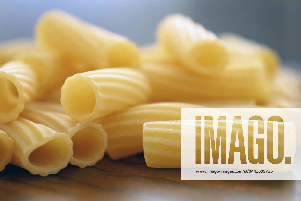Close-up of uncooked rigatoni pasta on wood surface Fort Wayne, Indiana, United States R_GCNK240325-1374773-01 ,property released