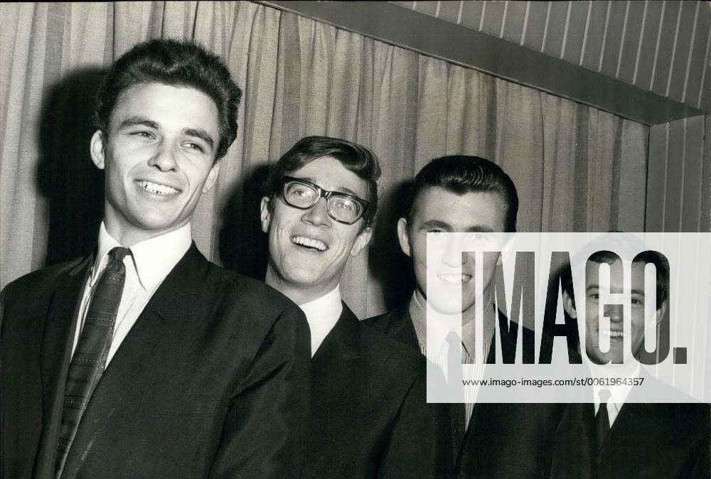 Nov. 11, 1963 - New Shadow meets the Group: 21 year old John Rostill has joined the famous Shadows instrumental group as bass guitarist in place of Brian Liquorice Locking who has left to device more time to his religion. John Rostill is a former pupil of Rutlish School. Photo shows John Rostill (left) meets the rest of the group (left to right) Hank B. Marvin, Bruce Welch and Brian Bennett. - ZUMAk09