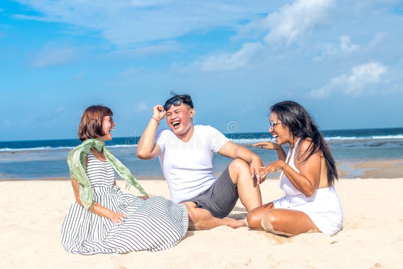 Group of multiracial friends having fun on the beach of tropical Bali island, Indonesia., Group of multiracial friends having fun on the beach of tropical Bali island.