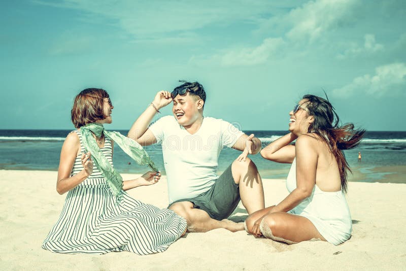 Group of multiracial friends having fun on the beach of tropical Bali island, Indonesia., Group of multiracial friends having fun on the beach of tropical Bali island.