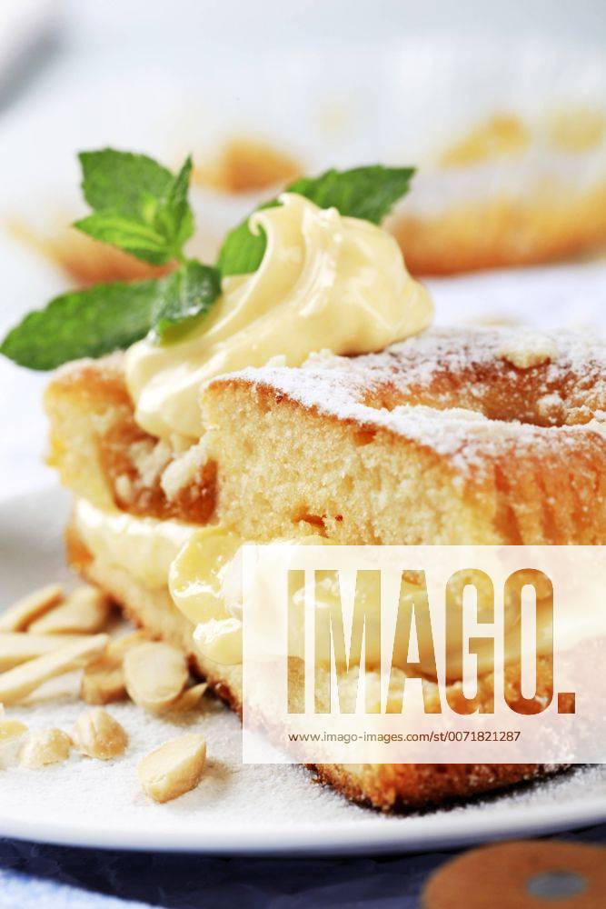 Slices of apricot sponge cake with pudding cream Apricot sponge cake with pudding cream xdigifoodstockx CTKPhoto201510150700301