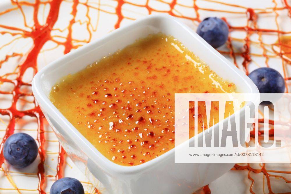 Creme brulee garnished with caramelized sugar decoration and blueberries CTKPhotoF201704110895701
