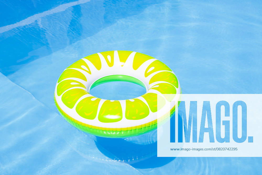 Colorful inflatable pool float in a sunny swimming pool property released, FLMF01412