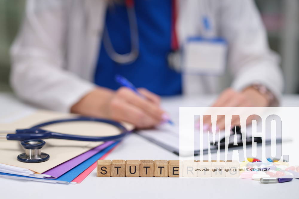 Dr. Taking Detailed Notes on Stuttering Patient Care and Treatment Strategies and Observations A healthcare professional documenting stuttering therapy plans, emphasizing communication disorders., model released, , 64329762.jpg RECORD DATE NOT STATED