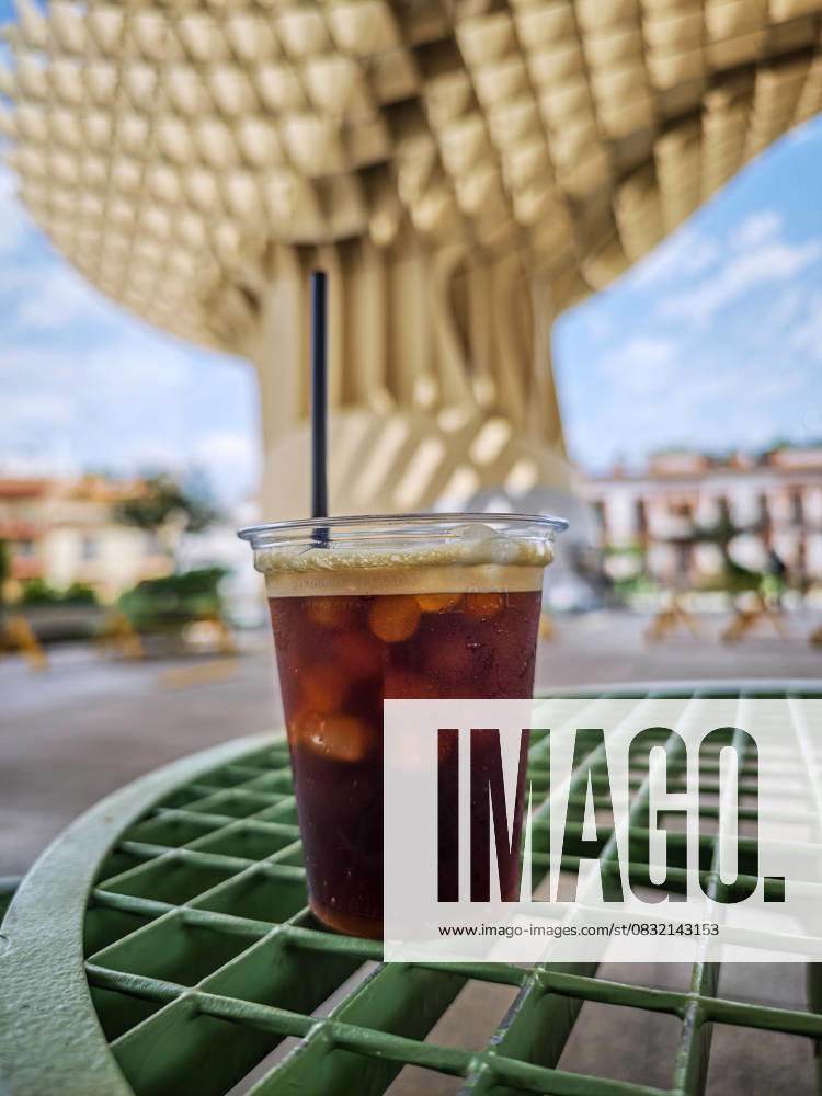 IMAGO Creative, Food, Trend, Iced Coffee Iced coffee sits on a green table, offering refreshment in the shade beneath Las Setas in Seville. A perfect way to cool off. Spain