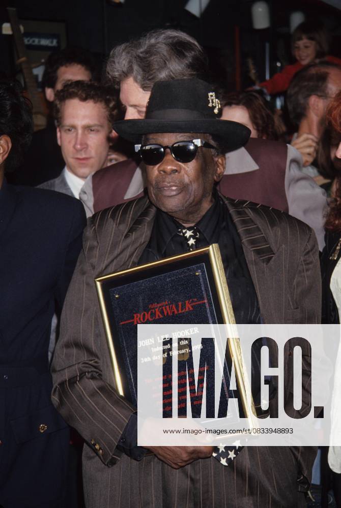 JOHN LEE HOOKER JOHN LEE HOOKER with Bonnie Raitt.John Lee Hooker inducted into Hollywood s Rock Walk 1995.