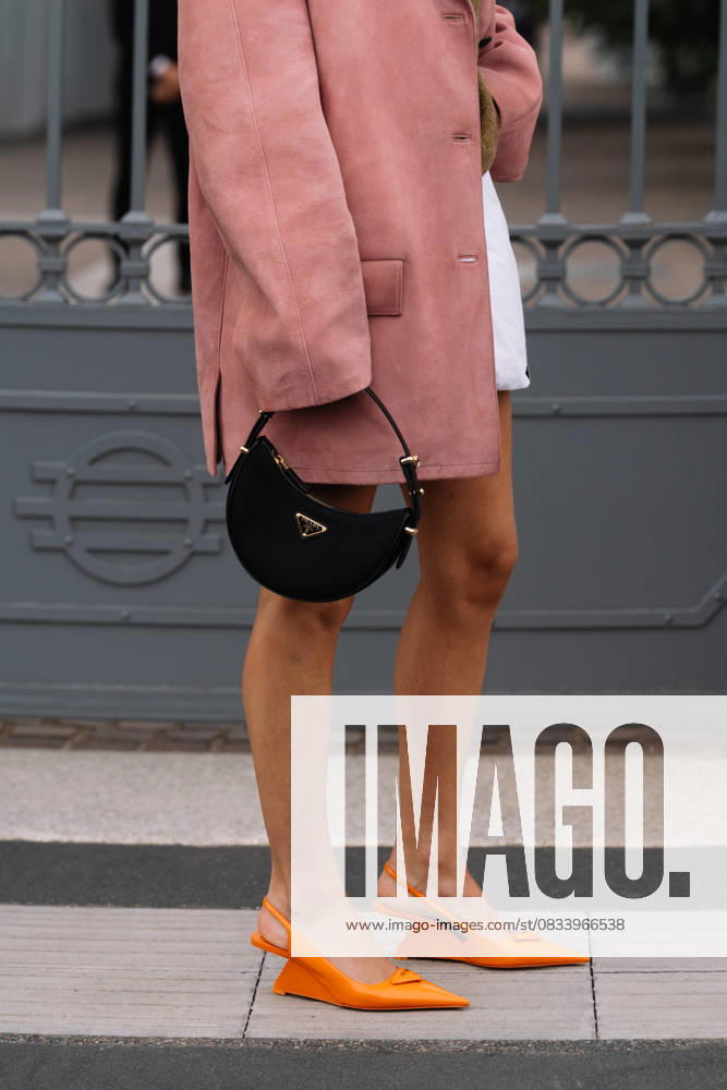 Milan, Italy - September, 21, 2023: woman wears orange brushed leather pumps, high heels from Prada and shoulder bag Milan, Italy - September, 21, 2023: woman wears orange brushed leather pumps, high heels from Prada and shoulder bag, street style accessories, 96472744