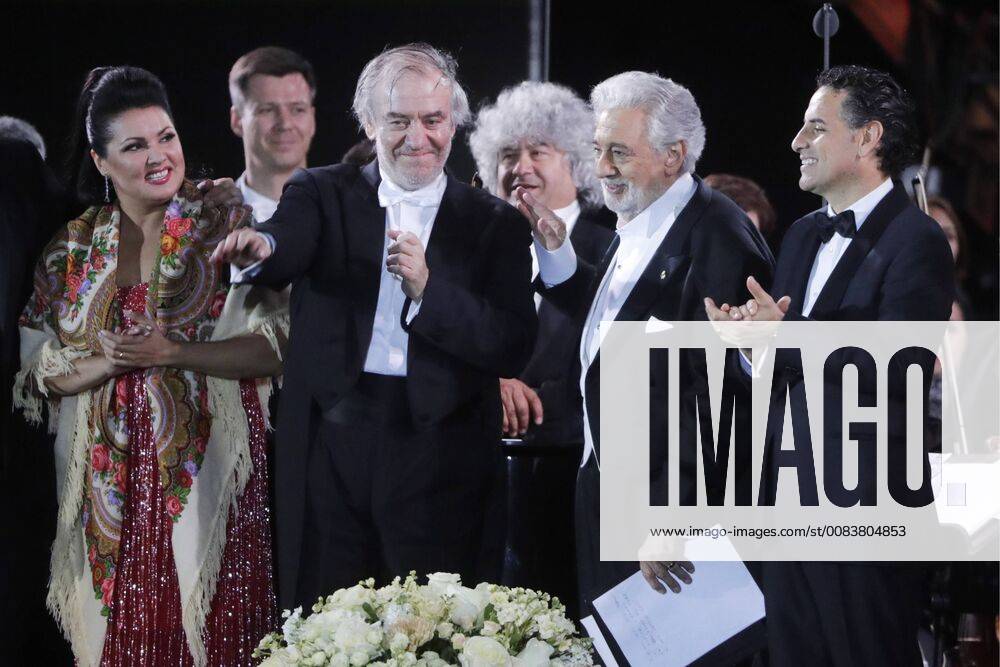 MOSCOW, RUSSIA â€“ JUNE 13, 2018: Russian soprano Anna Netrebko, Mariinsky Theatre artistic director, conductor Valery Gergiev, Spanish tenor Placido Domingo, and Peruvian tenor Juan Diego Florez (L-R front) perform during concert by opera stars ahead of the 2018 FIFA World Cup, at Moscow s Red Square. Mikhail Metzel TASS TS083FE1
