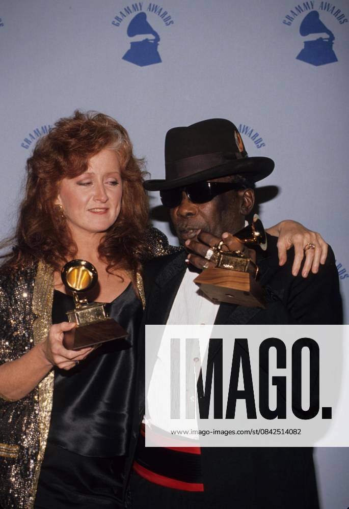 John Lee Hooker and Bonnie Raitt at the 32nd Annual Grammy Awards, presented at Shrine Auditorium, Los Angeles. on February 21, 1990