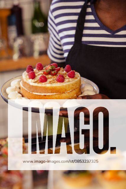 Close up view of appetizing cake Close up view of appetizing cake at coffee shop, model released, , property released, Cape Town, South Africa, 07.02.2016, 753529.jpg, shop, cafe, retail, coffee shop, cafeteria, restaurant, staff, food and drink industry, food, lifestyle, coffee house, cake, appetizing, delicious, pastries, meal, cooking, closeup, strawberries, fruit, plate, presentation, home, presenting 30s, Mid Adult, Man, Male, Black, 30-34 Years, Mid Adult Men, African Ethnicity