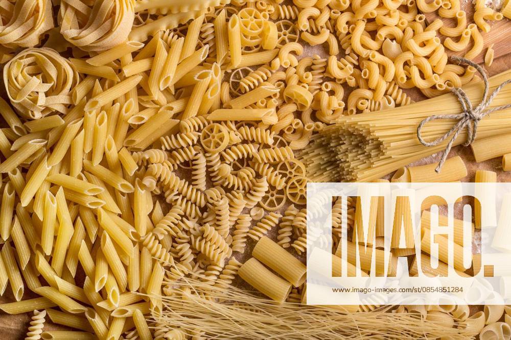 Variety of types and shapes of dry pasta
