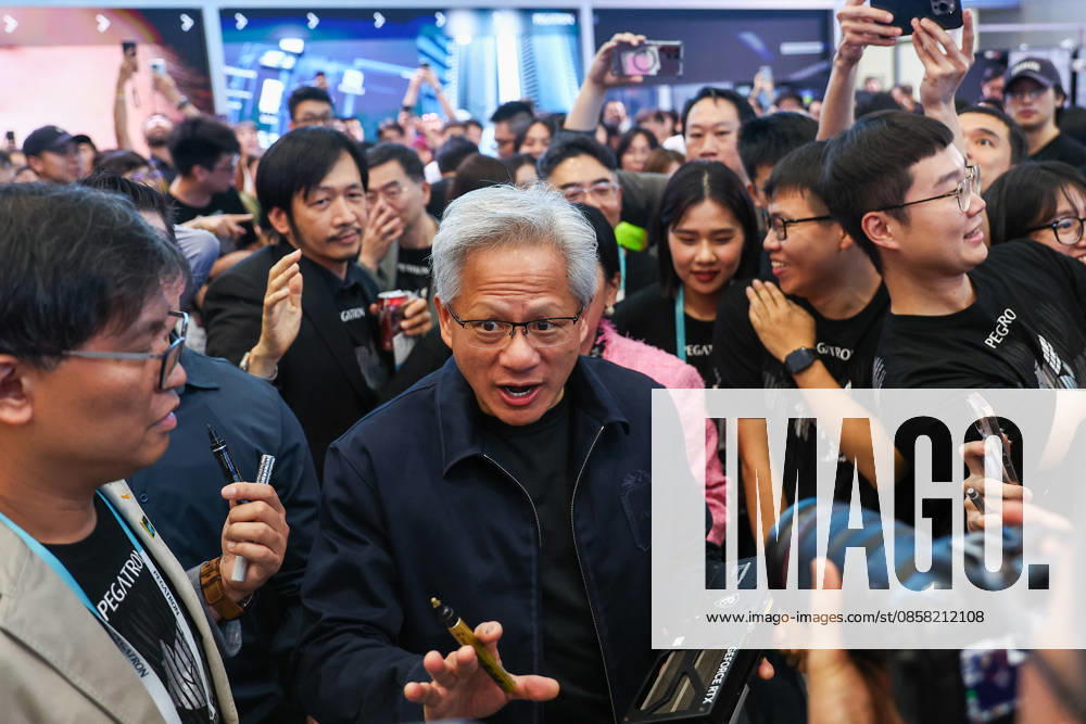 NVIDIA s CEO Jensen Huang visits COMPUTEX TAIPEI 2026 TAIPEI, TAIWAN - JUNE 3: Jensen Huang, the CEO of American multinational tech giant NVIDIA, signs autographs for fans as he is surrounded by heaps of supporters and staff during his visit to the COMPUTEX TAIPEI trade show, in Taipei, Taiwan, on June 3, 2026. COMPUTEX TAIPEI is one of the world’s largest and most significant trade shows, featuring latest technologies, drones, data centres, Artificial Intelligence (AI) technologies, supercomputers, semiconductors products and other things from major international firms such as Nvidia, Intel, NXP and Foxconn. Daniel Ceng Anadolu Taipei Taiwan. Editorial use only. Please get in touch for any other usage.