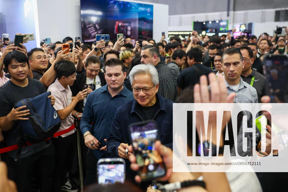 NVIDIA s CEO Jensen Huang visits COMPUTEX TAIPEI 2026 TAIPEI, TAIWAN - JUNE 3: Jensen Huang, the CEO of American multinational tech giant NVIDIA, signs autographs for fans as he is surrounded by heaps of supporters and staff during his visit to the COMPUTEX TAIPEI trade show, in Taipei, Taiwan, on June 3, 2026. COMPUTEX TAIPEI is one of the world’s largest and most significant trade shows, featuring latest technologies, drones, data centres, Artificial Intelligence (AI) technologies, supercomputers, semiconductors products and other things from major international firms such as Nvidia, Intel, NXP and Foxconn. Daniel Ceng Anadolu Taipei Taiwan. Editorial use only. Please get in touch for any other usage.