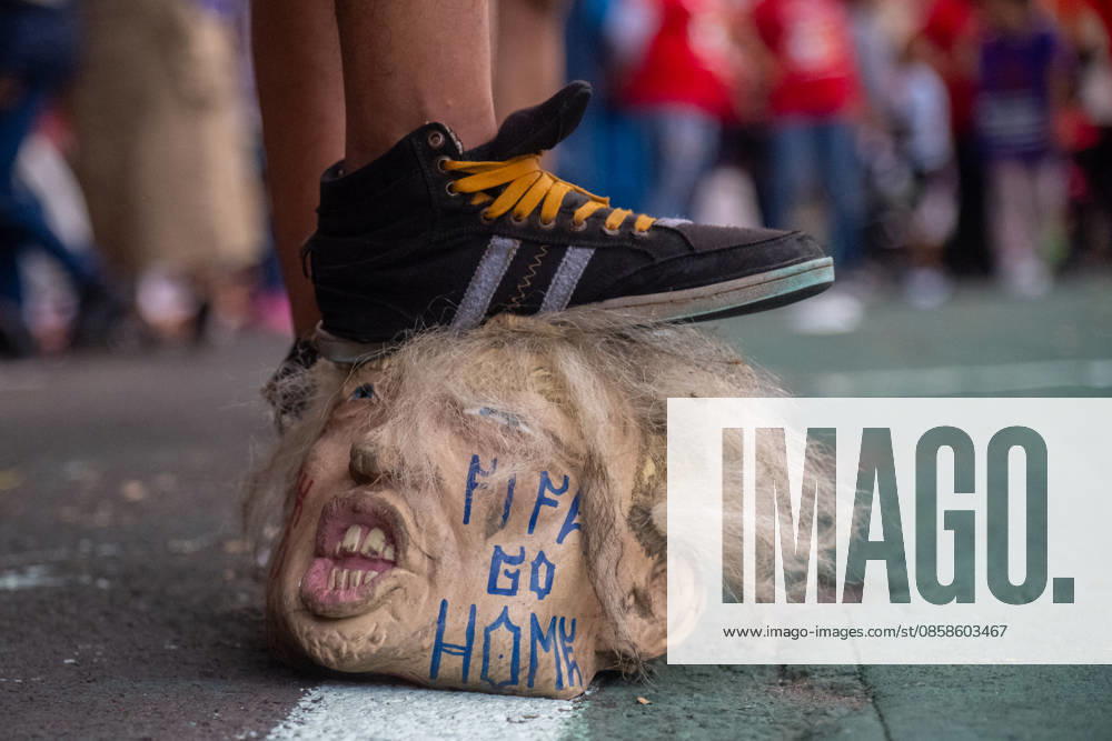 A member of the Otomi indigenous community residing in Mexico City steps on a U.S President Donald Trump latex mask during the Anti-World Cup rally as a protest against forced displacement and in memory of activist Samir Flores as part of the protests against the 2026 FIFA World Cup. on June 6, 2026 in Mexico City, Mexico. Mexico City Mexico - ZUMAe321 20260606_zia_e321_048
