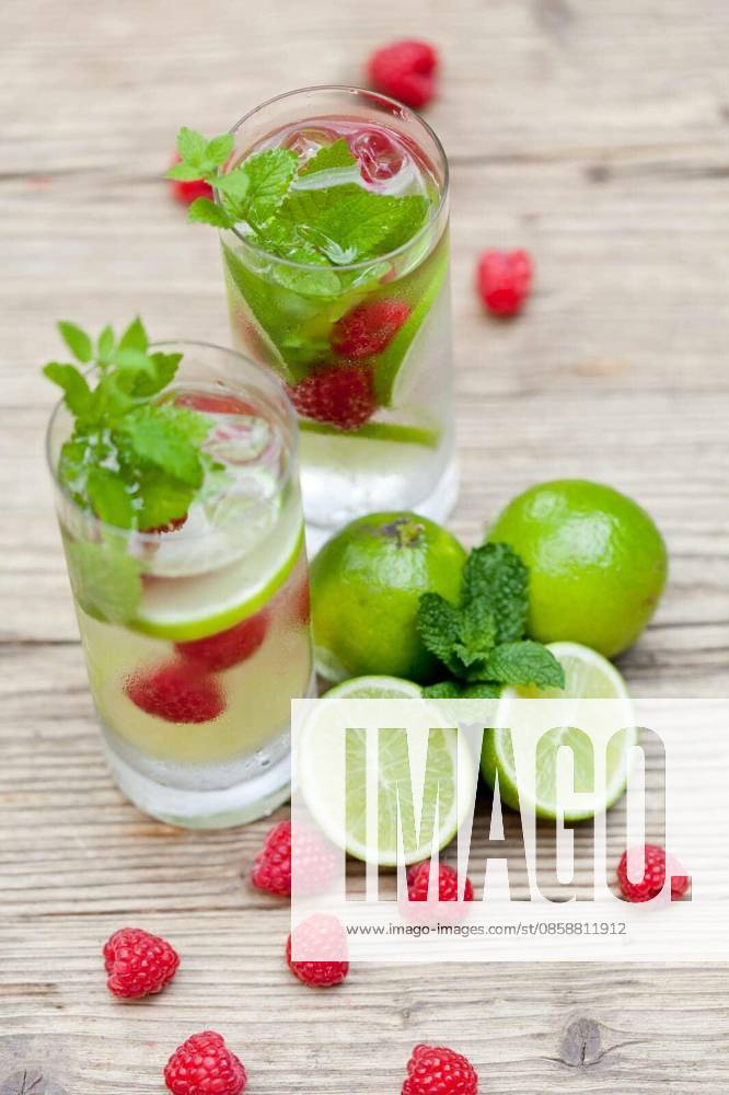 Summer soft drink lemonade with lime raspberry mint mineral water