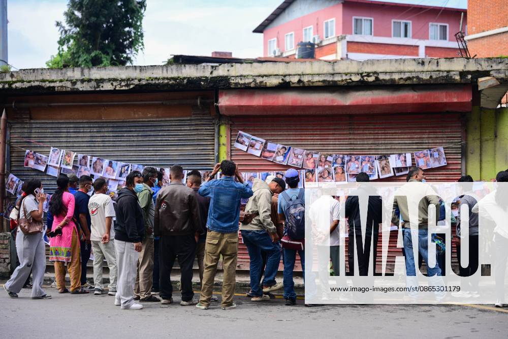 KATHMANDU, NEPAL, AUGUST 30, 2026: Relatives search for missing family members at Tribhuvan University Teaching Hospital in Kathmandu, four days after flash floods struck Rasuwa and Nuwakot districts near the Nepal-China border. Families post photographs of missing loved ones on walls and noticeboards and examine missing-person notices as search, rescue and identification efforts continue. The floods swept through communities before surging downstream along the Trishuli River, damaging homes and infrastructure and leaving families awaiting information about those still unaccounted for. Kathmandu Nepal - ZUMAq101 20260830_zna_q101_039
