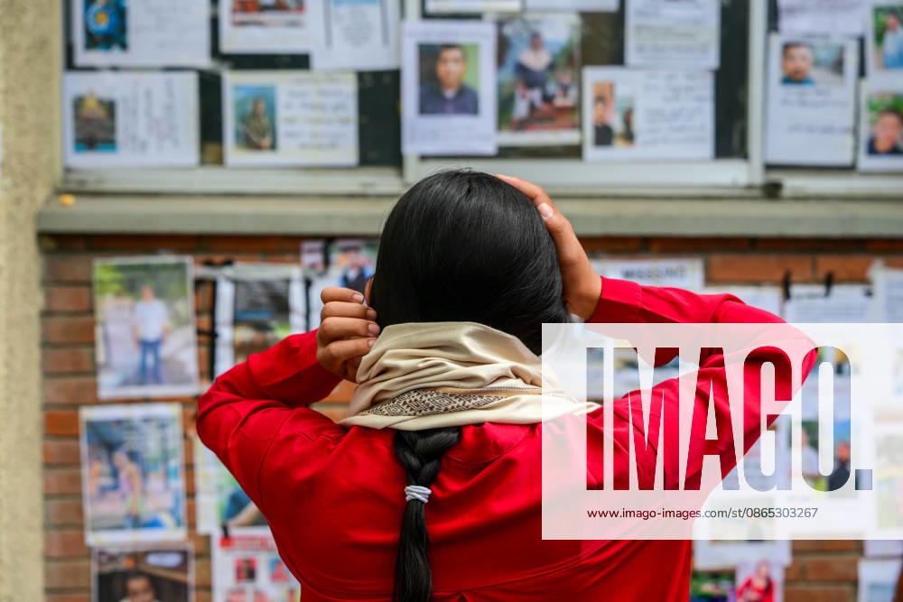 Relatives search for missing family members at Tribhuvan University Teaching Hospital in Kathmandu, Nepal, four days after devastating flash floods struck areas near the Nepal-China border on August 26, 2026. Some relatives paste photographs of missing loved ones on walls and noticeboards, while others carefully examine photographs and missing-person notices in the hope of identifying or locating family members. Some are seen breaking down in tears as they wait for information about their loved ones. As of August 30, authorities had recovered 734 bodies, while 2,498 people remained missing. Kathmandu Nepal - ZUMAs330 20260830_zsp_s330_032
