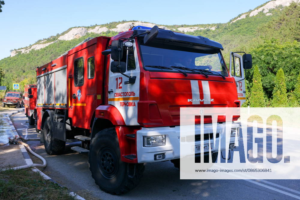 RUSSIA, REPUBLIC OF CRIMEA - AUGUST 30, 2026: Fire crews at the scene of a wildfire on Chishma-Kaya Rocks in the vicinity of Mangul-Kale in the Bakhchisarai District. Maxim Churusov TASS 96853280
