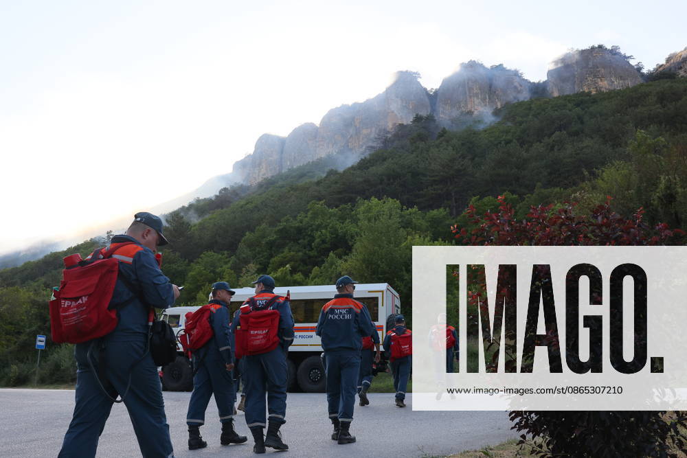 RUSSIA, REPUBLIC OF CRIMEA - AUGUST 30, 2026: Emergency service workers at the scene of a wildfire on Chishma-Kaya Rocks in the vicinity of Mangul-Kale in the Bakhchisarai District. Maxim Churusov TASS 96853719