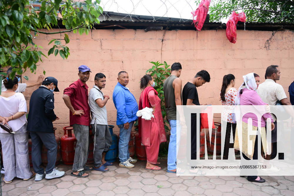 Customers wait in long queues to receive liquefied petroleum gas (LPG) cylinders in Kathmandu, Nepal, on August 31, 2026, as the devastating Rasuwa floods add further pressure to an already strained cooking gas distribution system. Nepal had already been facing long queues and difficulties obtaining LPG, with increased demand and distribution problems affecting consumers. The catastrophic flash floods that struck near the Nepal-China border on August 26 swept away homes, vehicles, roads, bridges and other infrastructure, while LPG cylinders were also carried away by the powerful floodwaters. Some people were seen entering the floodwaters and swimming to retrieve the cylinders. The disaster disrupt - ZUMAs330 20260831_zsp_s330_006