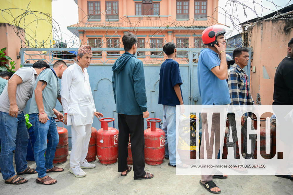 Customers wait in long queues to receive liquefied petroleum gas (LPG) cylinders in Kathmandu, Nepal, on August 31, 2026, as the devastating Rasuwa floods add further pressure to an already strained cooking gas distribution system. Nepal had already been facing long queues and difficulties obtaining LPG, with increased demand and distribution problems affecting consumers. The catastrophic flash floods that struck near the Nepal-China border on August 26 swept away homes, vehicles, roads, bridges and other infrastructure, while LPG cylinders were also carried away by the powerful floodwaters. Some people were seen entering the floodwaters and swimming to retrieve the cylinders. The disaster disrupt - ZUMAs330 20260831_zsp_s330_003