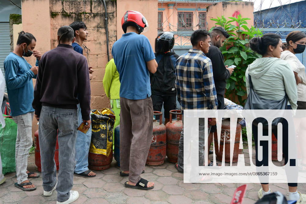 Customers wait in long queues to receive liquefied petroleum gas (LPG) cylinders in Kathmandu, Nepal, on August 31, 2026, as the devastating Rasuwa floods add further pressure to an already strained cooking gas distribution system. Nepal had already been facing long queues and difficulties obtaining LPG, with increased demand and distribution problems affecting consumers. The catastrophic flash floods that struck near the Nepal-China border on August 26 swept away homes, vehicles, roads, bridges and other infrastructure, while LPG cylinders were also carried away by the powerful floodwaters. Some people were seen entering the floodwaters and swimming to retrieve the cylinders. The disaster disrupt - ZUMAs330 20260831_zsp_s330_004