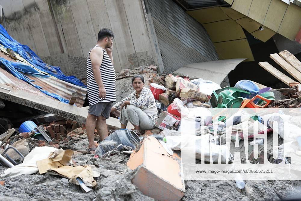Residents clear items from the rubble of their homes on September 1, 2026 in Nuwakot, Nepal. Areas of Nepal are still out of the reach of rescue teams, according to the UN, while the death toll from the disaster now exceeds 1,000.