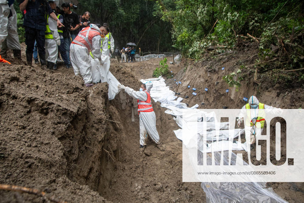 Bodies of unidentified victims wrapped in shrouds lie at a temporary burial trench in Gokarna, Kathmandu. Emergency teams collected DNA samples and forensic records prior to interment to assist family identification efforts later. Kathmandu Nepal - ZUMAs197 20260901_aaa_s197_244
