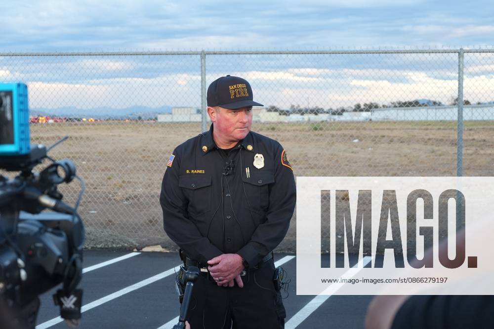 San Diego Fire-Rescue Deputy Fire Chief Brian Raines speaks to news media after the plane crashes at the runway..A small plane crashes and catches fire on the runway at Montgomery-Gibbs Executive Airport in Kearny Mesa of San Diego. Two people are killed in the crash, which is reported at about 5:20 p.m., according to San Diego police and fire-rescue officials. The Federal Aviation Administration temporarily close the airport as crews work at the scene and investigators begin determining the cause of the crash. San Diego United States - ZUMAs197 20260907_aaa_s197_593