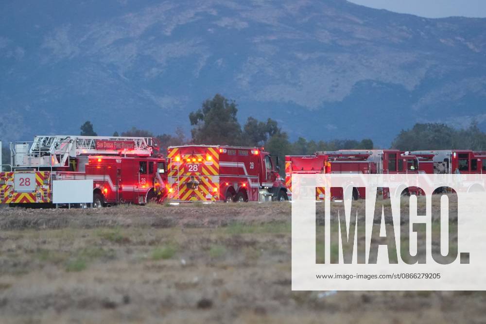 Firefighters from San Diego Fire-Rescue respond to the scene after the plane crashes at the runway..A small plane crashes and catches fire on the runway at Montgomery-Gibbs Executive Airport in Kearny Mesa of San Diego. Two people are killed in the crash, which is reported at about 5:20 p.m., according to San Diego police and fire-rescue officials. The Federal Aviation Administration temporarily close the airport as crews work at the scene and investigators begin determining the cause of the crash. San Diego United States - ZUMAs197 20260907_aaa_s197_595